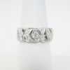 Picture of Pierced Platinum & Round Brilliant Cut Diamond Wedding Band with Milgrain Detailing