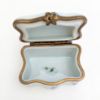 Picture of Vintage Traditional Casket Style Limoges Trinket Box With Flower, Ribbon & Insect Motif.