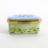 Picture of Halcyon Days for the Smithsonian Enameled Easter Box Featuring Bunnies on a Tandem Bicycle