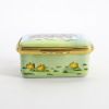 Picture of Halcyon Days for the Smithsonian Enameled Easter Box Featuring Bunnies on a Tandem Bicycle