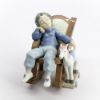 Picture of Lladro #5846 'All Tuckered Out' Boy Sleeping in Rocking Chair with Toy Horse Porcelain Figurine