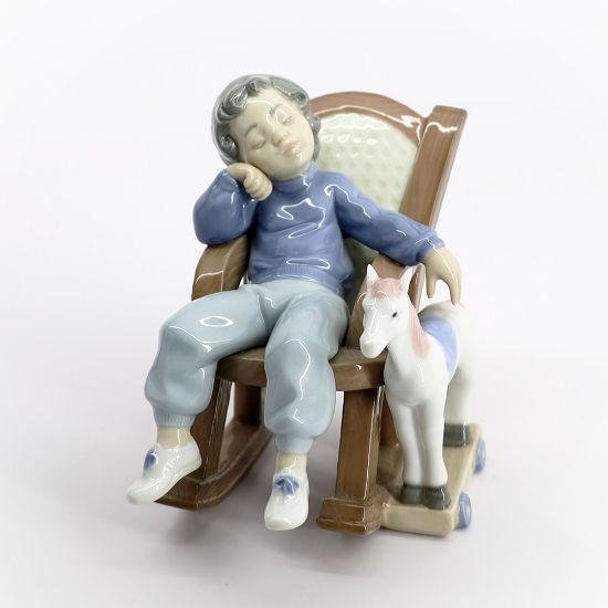 Picture of Lladro #5846 'All Tuckered Out' Boy Sleeping in Rocking Chair with Toy Horse Porcelain Figurine