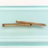 Picture of Edwardian Era Pair Of 14K Yellow Gold, Seed Pearl & White Enamel Bar Brooches